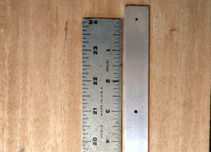 Measuring out the holes in the aluminum flat bar