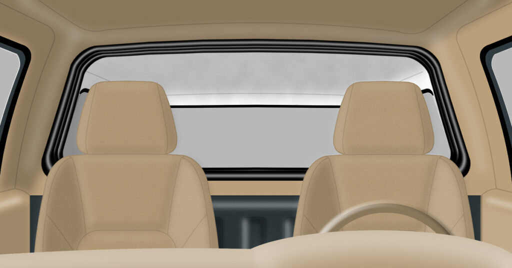 Inside cab view of truck with a camper shell