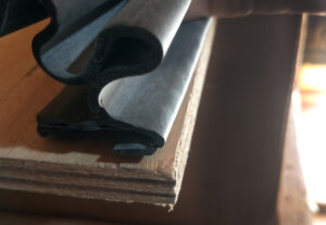 Placing the boot onto the flat surface over the bead of polyurethane